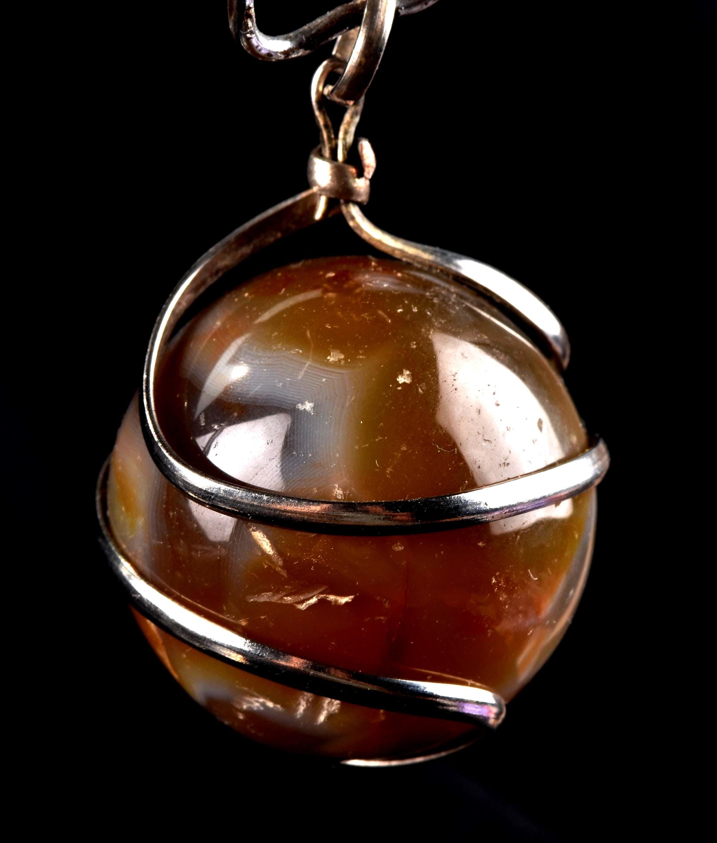 old carnelian sphere with cave   pendant creativity courage protection strength   #7148
