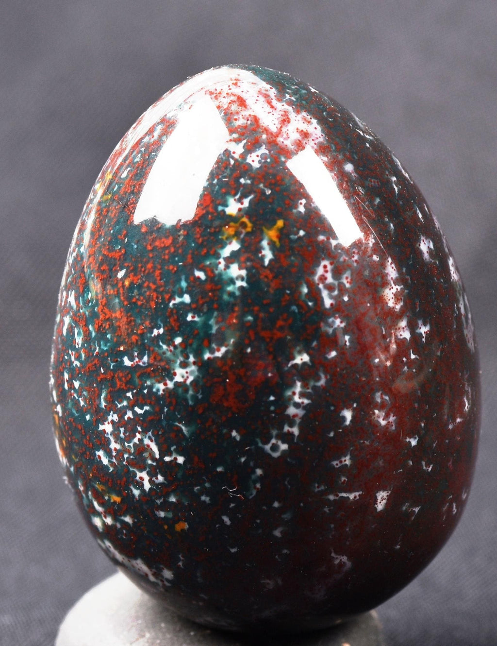 Blood stone  egg  energy and strength ,constant energy flows    grounding negative energy and cleansing the body  8107